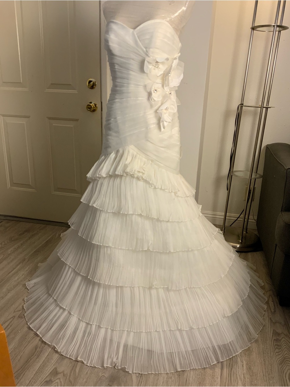 Strapless White Ruffle-Tiered Wedding Gown with Floral Detail